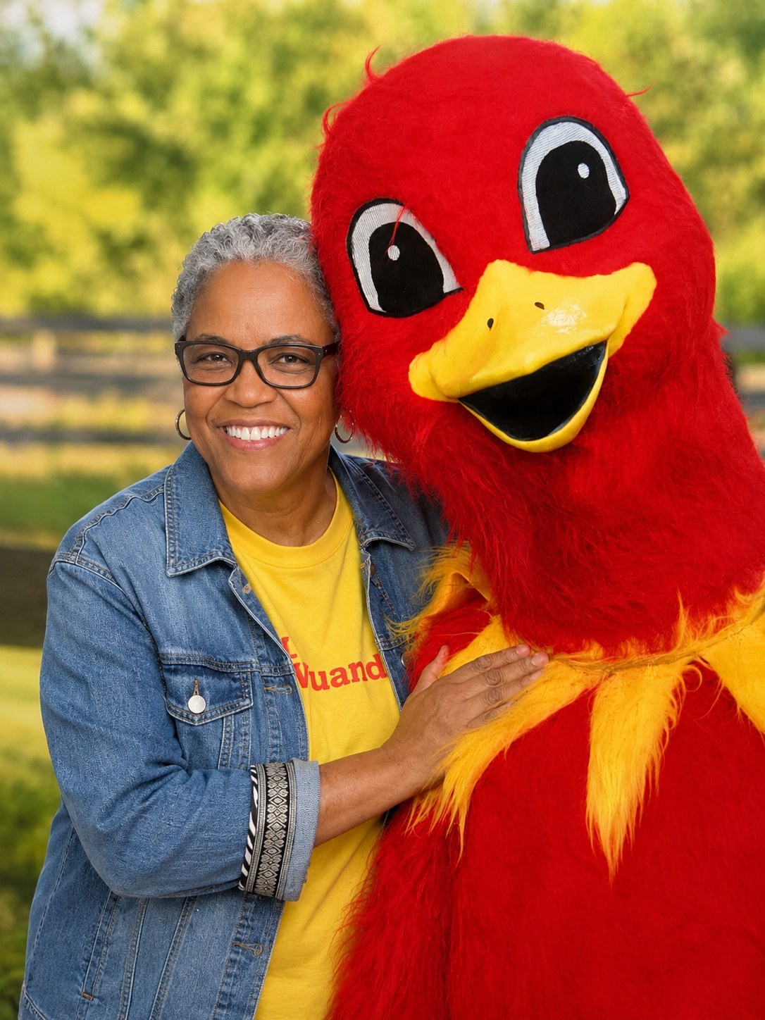 Pat Winston smiling with Earl the Emu